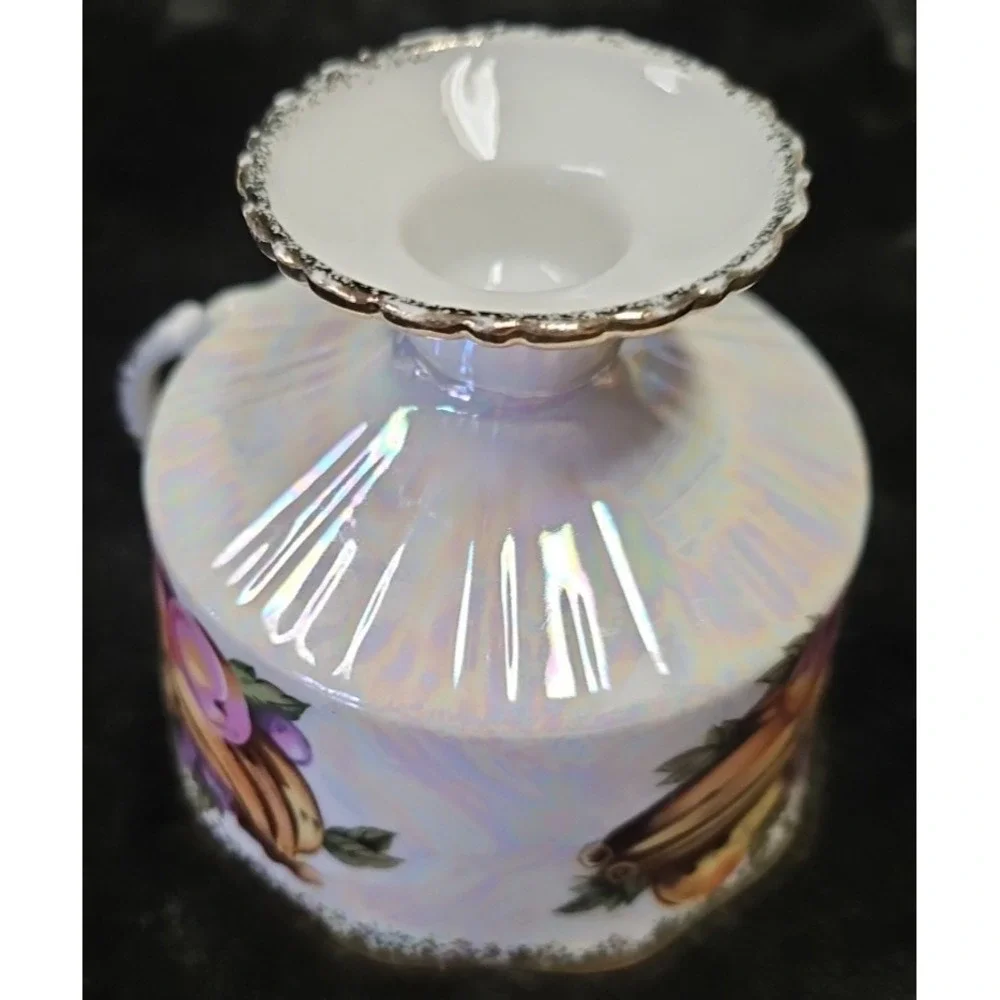 Lusterware Handpainted Fruit with gold finishings,‎ footed cup and saucer set